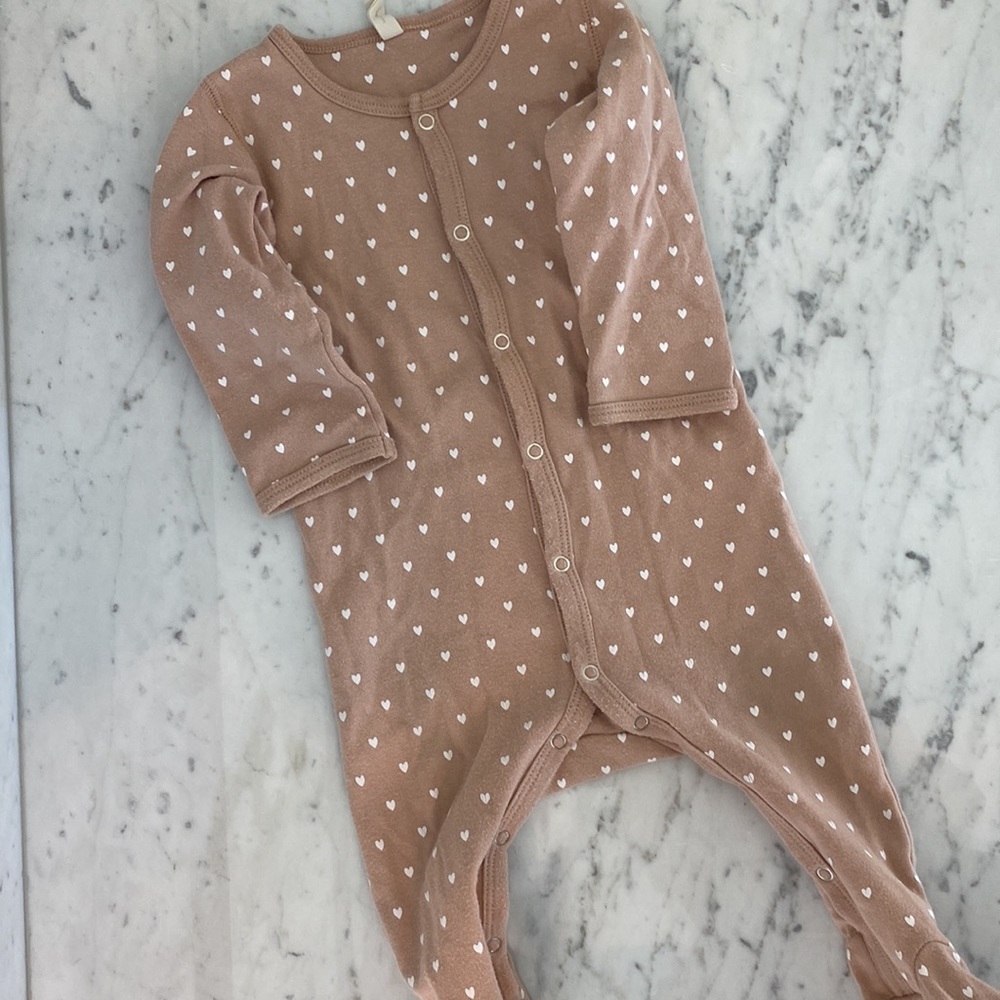 Nude footie pajamas with heart print. All organic cotton.